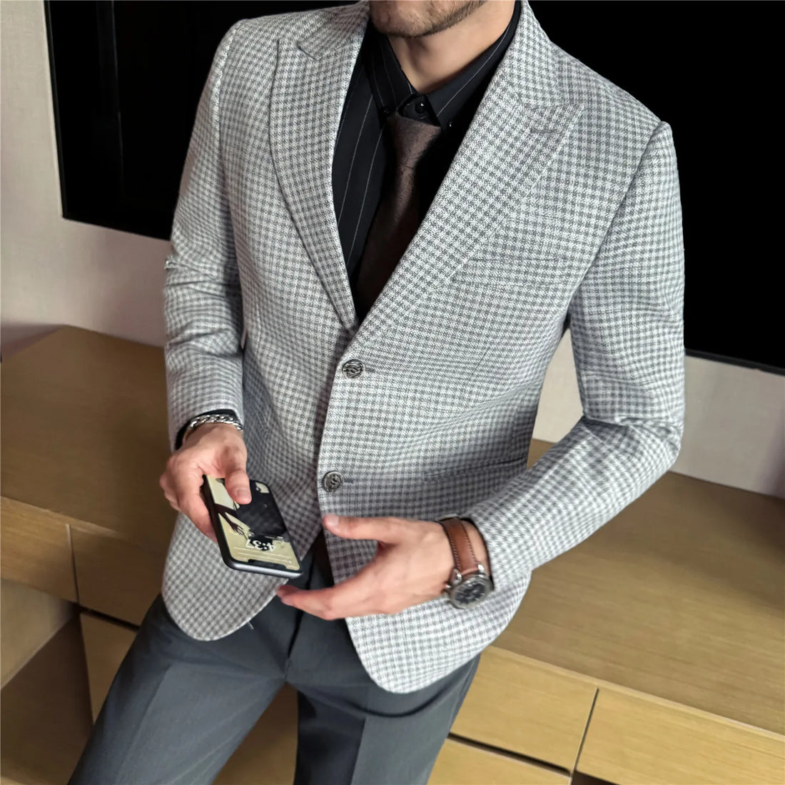 A thick checkered suit jacket in the style of old coins made of wool, a high-end checkered suit in coffee color
